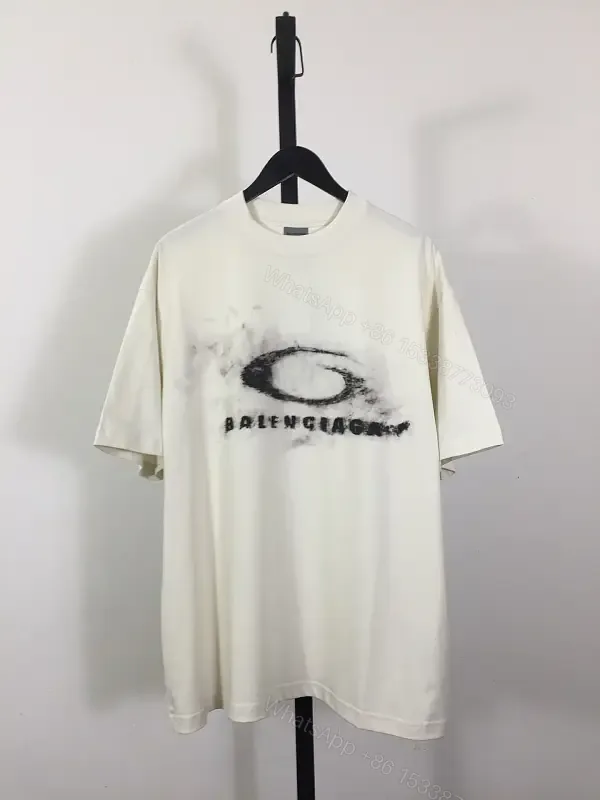 View 1 of Ivory Cotton Oversized Tee – Distressed Logo Streetwear Edge