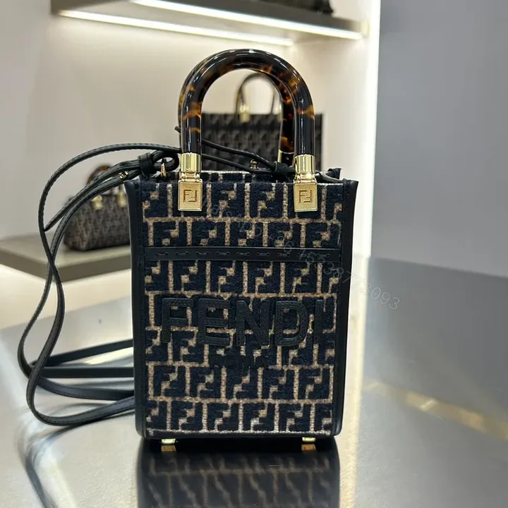 View 1 of Chic Monogram Mini Handbag: Luxe Texture & Structured Carry