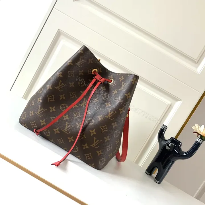 View 1 of Louis Vuitton-Style Monogram Bucket Bag: Red Leather Drawstring, Tote-like Versatility
