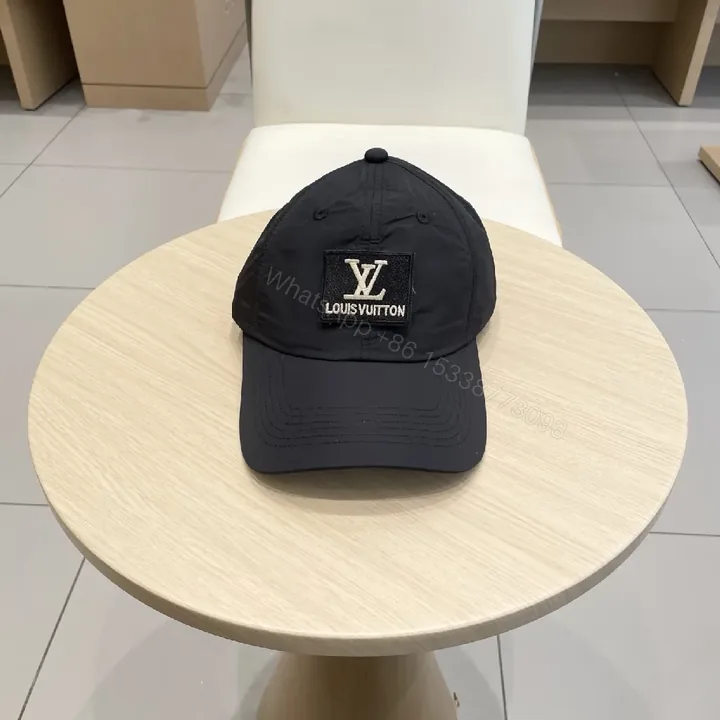 View 1 of Compact Black Cap with Subtle LV Patch, Six-Panel, Adjustable Strap