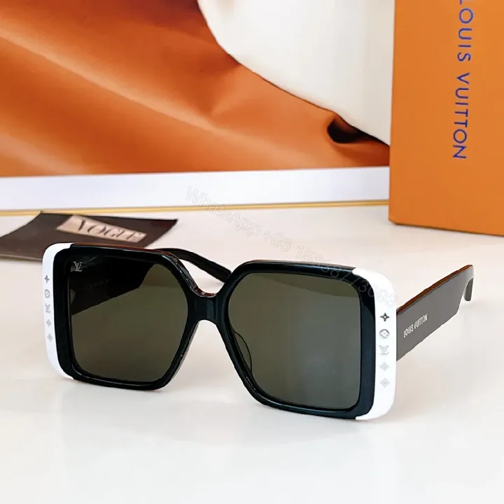 View 1 of Bold Black & White Frame Sunglasses with LV Detailing Luxe