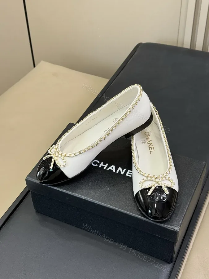 View 1 of Ivory & Black Two-Tone Ballet Flats with Gold Chain Accent