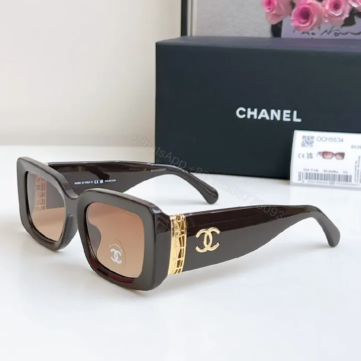 View 1 of Bold Black Leather-Accented Sunglasses with Gold Accents