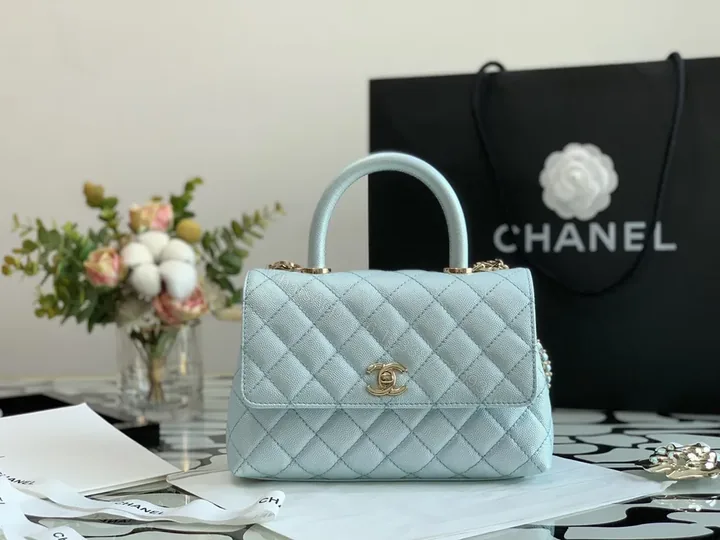 View 1 of Pastel Blue Quilted Bag with Gold CC Accents - Luxe Compact Purse