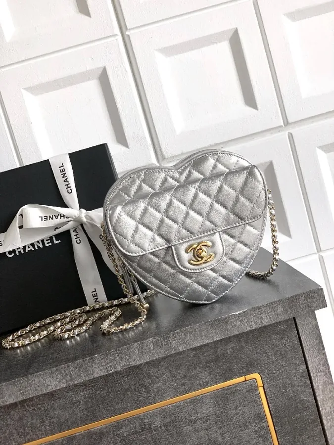 View 1 of Heart-Shaped Quilted Metallic Bag with Gold Hardware