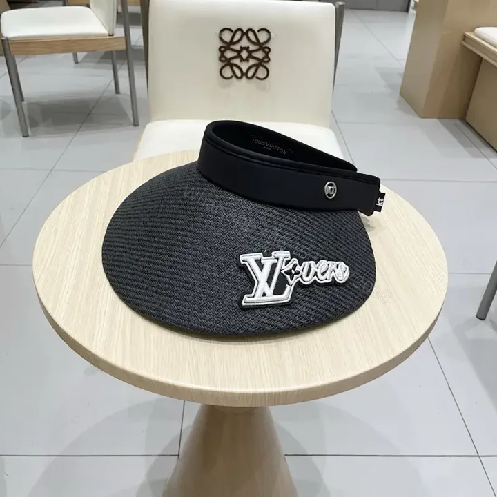 View 1 of Bold Sun Visor with LV Flair: Luxury-Casual Headwear