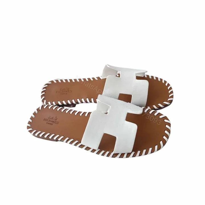 View 1 of HERMÈS ORAN SANDALS STITCHING IN BROWN AND WHITE