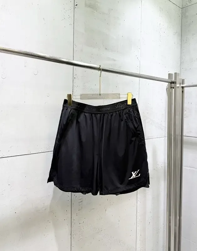 View 1 of Matte Black Quick-Dry Shorts with Subtle LV Detailing