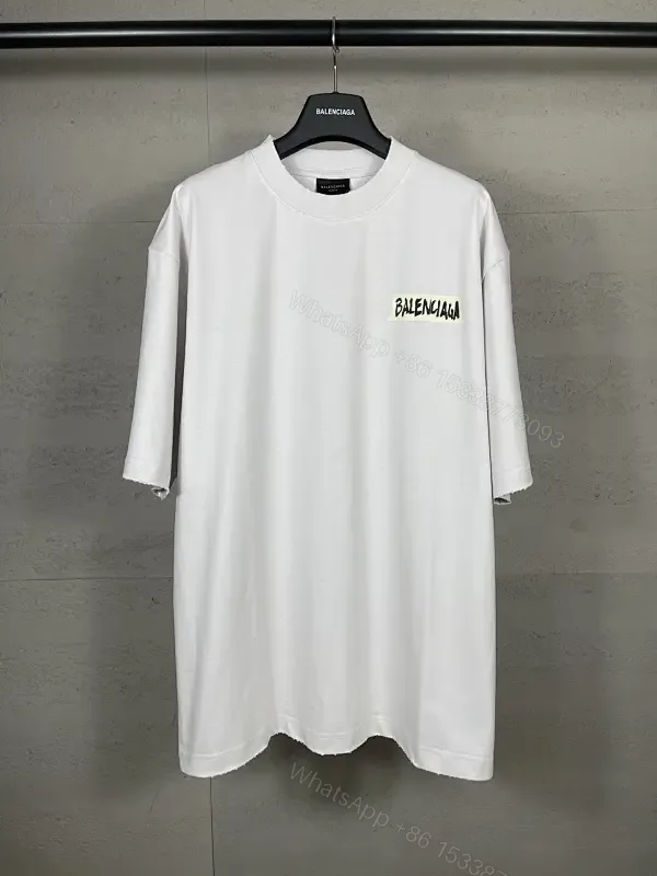View 1 of Oversized White Tee with Signature Patch - Minimalist Luxe