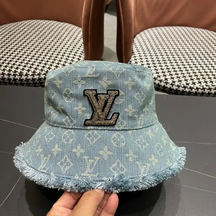 View 1 of Denim Bucket Hat with Monogram Detail – Casual Luxury & Comfort