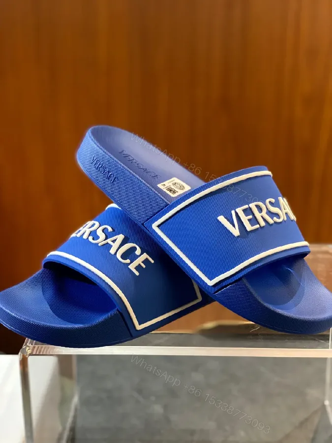 View 1 of Blue Synthetic Minimalist Slider with Bold Branding Slide Sandals