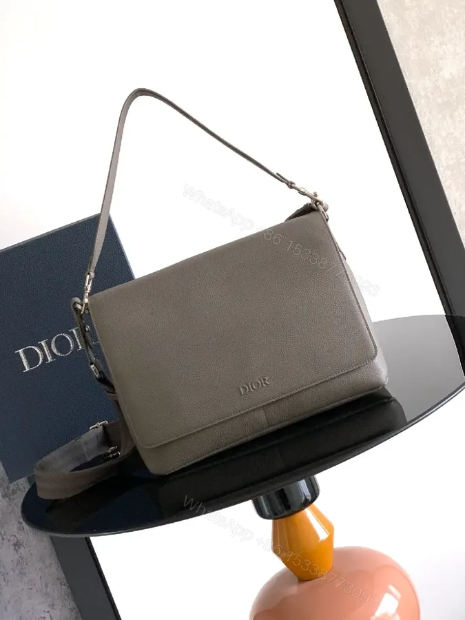 View 1 of Pebble Leather Crossbody: Subtle Branding, Quiet Luxury