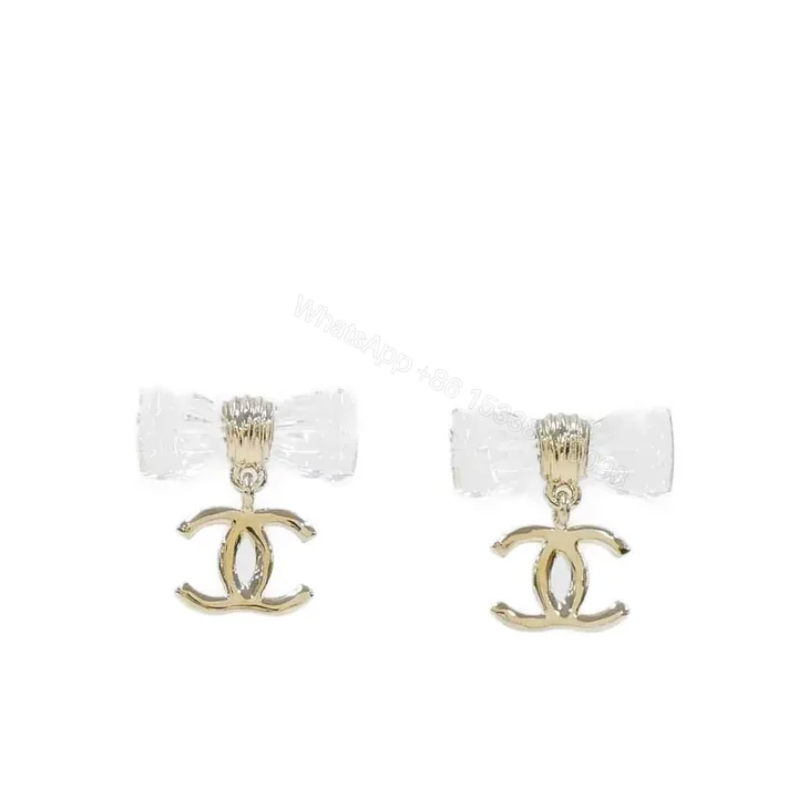 View 1 of CHANEL D25 CC BOW EARRINGS GOLD METAL ABF537 B19997 NAFVG