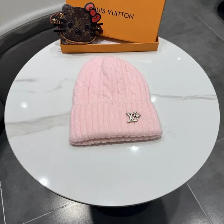 View 1 of Pastel Knit Beanie with Silver Emblem – Luxe Everyday Accessory