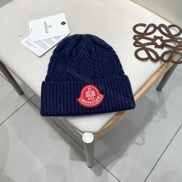 View 1 of Cozy Navy Knit Beanie with Ribbon Patch