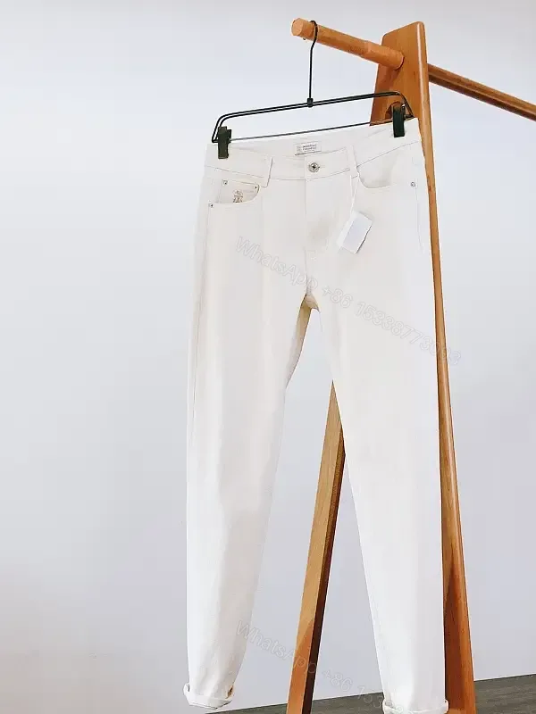 View 1 of Off-White Cream Straight-Leg Denim: Slim Tapered Pants with Five-Pocket Style