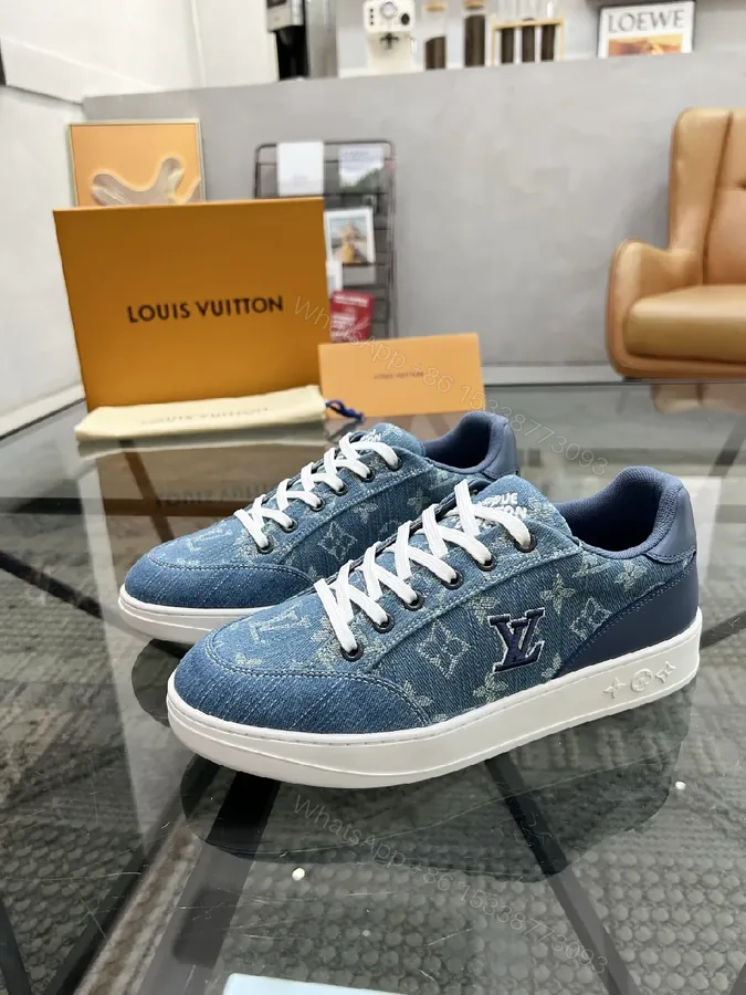 View 1 of Denim-Textured Luxury Sneakers with Monogram Embroidery