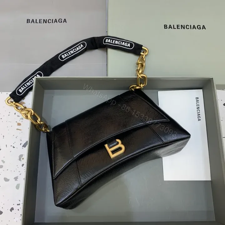 View 1 of Chic Black Leather Crossbody with Bold Gold Hardware Bag