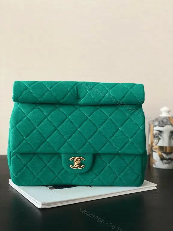 View 1 of Emerald Quilted Purse: Gold-Closure, Structured Luxe Bag