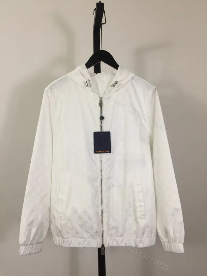 View 1 of White Zip-Front Jacket with Subtle Monogram Texture