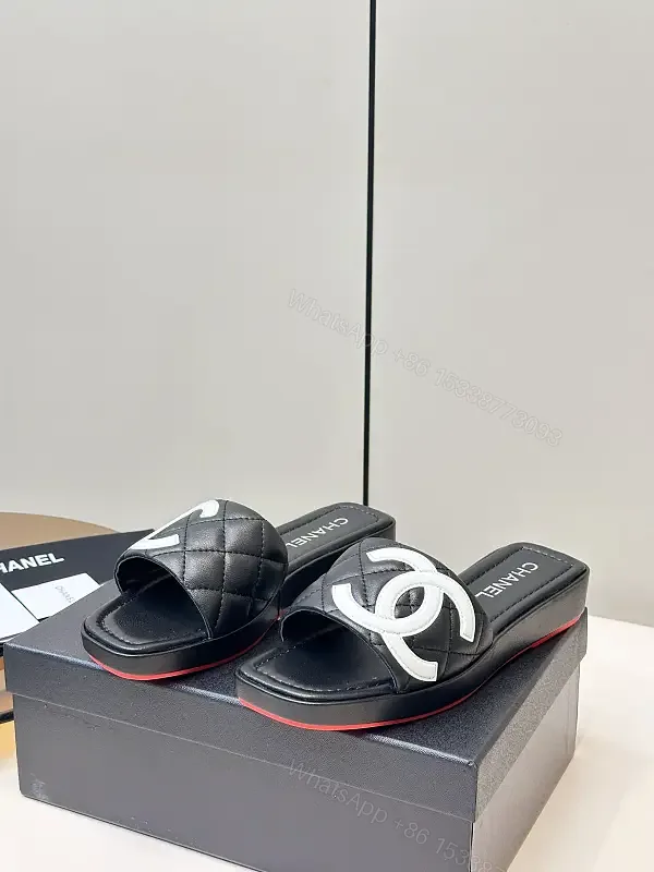 View 1 of Black Quilted Chanel Sliders with White Logo, Slide Sandals