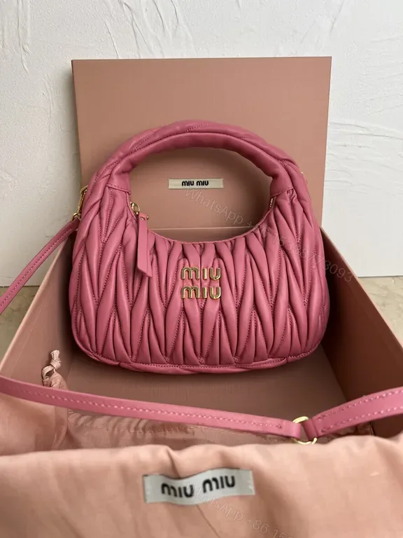 View 1 of Pink Quilted Miu Miu Mini Bag â€“ Luxury Everyday Chic