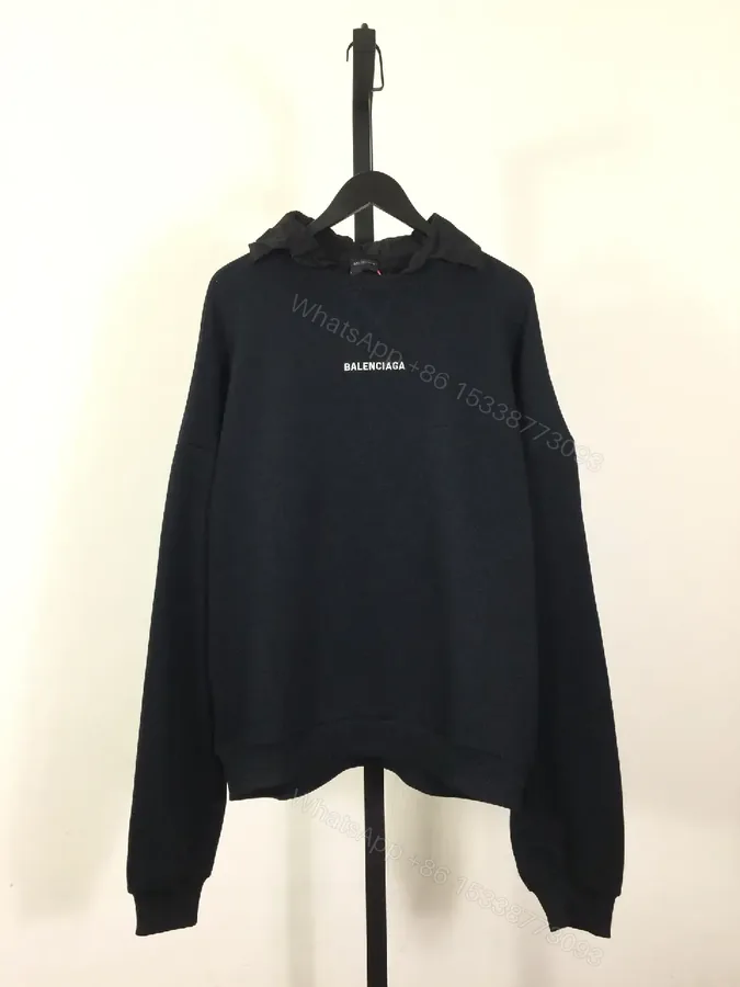View 1 of Deep Black Hoodie: Minimalist Logo, Premium Knitwear, Relaxed Fit