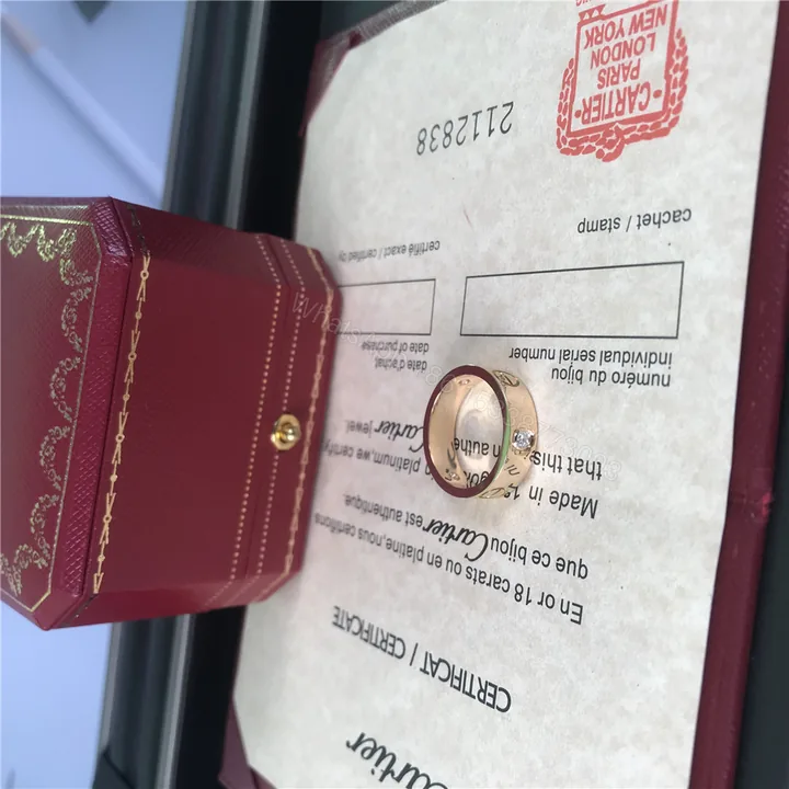 View 1 of Cartier Love Ring 3 Diamonds 5.5mm Yellow Gold B4032452
