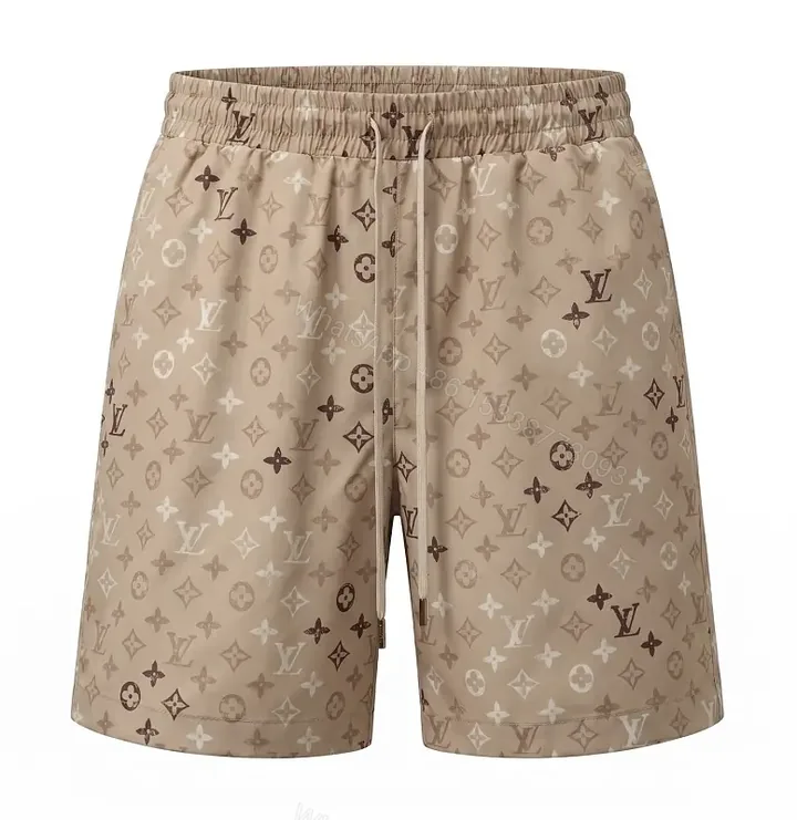 View 1 of Beige Monogram Print Drawstring Swim Shorts