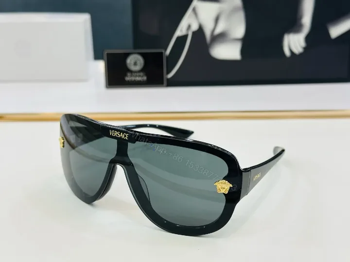 View 1 of Black Gloss Shield Sunglasses with Gold Emblems, Oversized Style