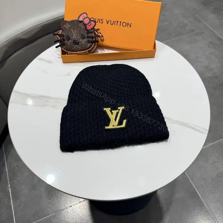 View 1 of Cozy Chic Beanie with Gold LV Emblem — Streetwise Luxury Beanie