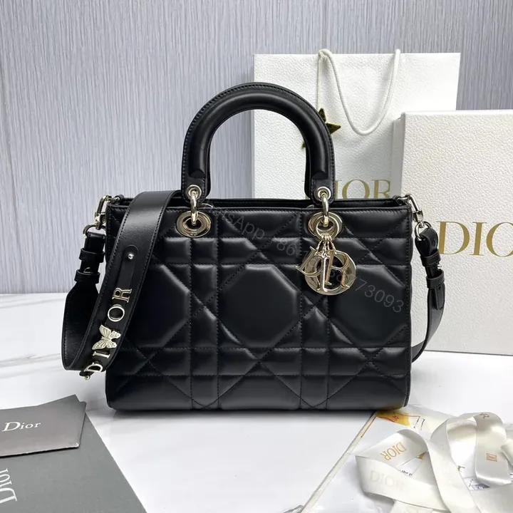 View 1 of Chic Black Quilted Mini Bag with Gold Dior Charms, All-Day Luxury