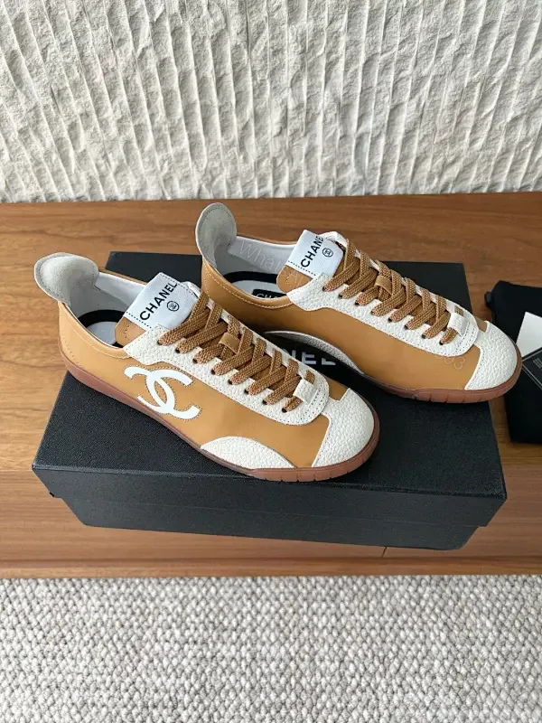 View 1 of Brown Leather High-Top Sneaker with Contrast Texture and Logo