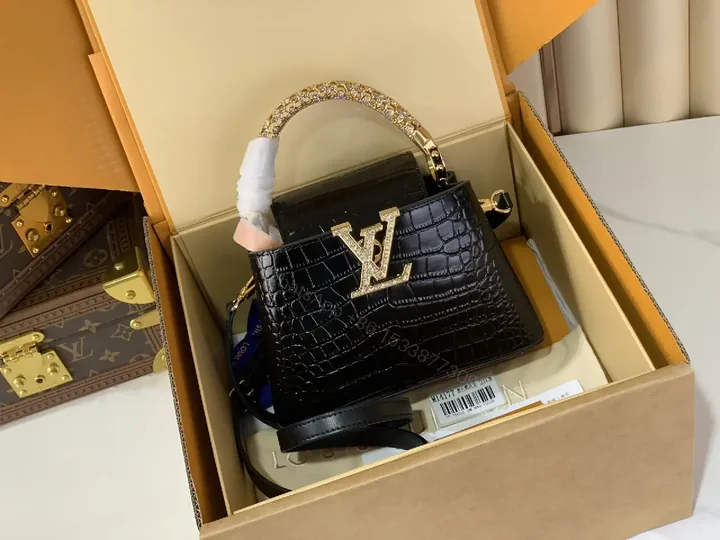 View 1 of Chic Black Crocodile-Embossed Mini Handbag with Gold Hardware