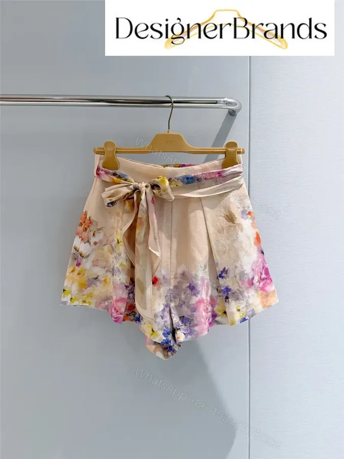 View 1 of Zimmermann Crush Tuck Floral Linen Shorts