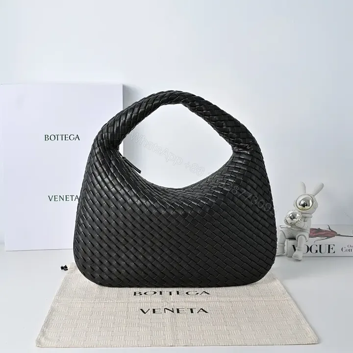 View 1 of Basketweave Handbag in Black – Premium Vegan Leather, Curved Handle, Compact Luxury Bag