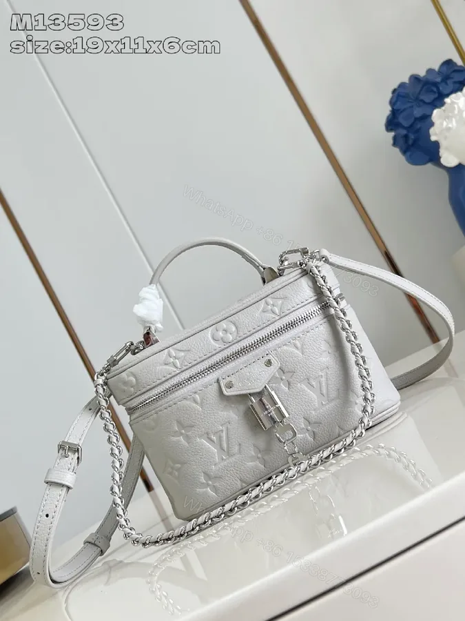 View 1 of Soft White Leather Compact Day-to-Night Bag with Textured Pattern