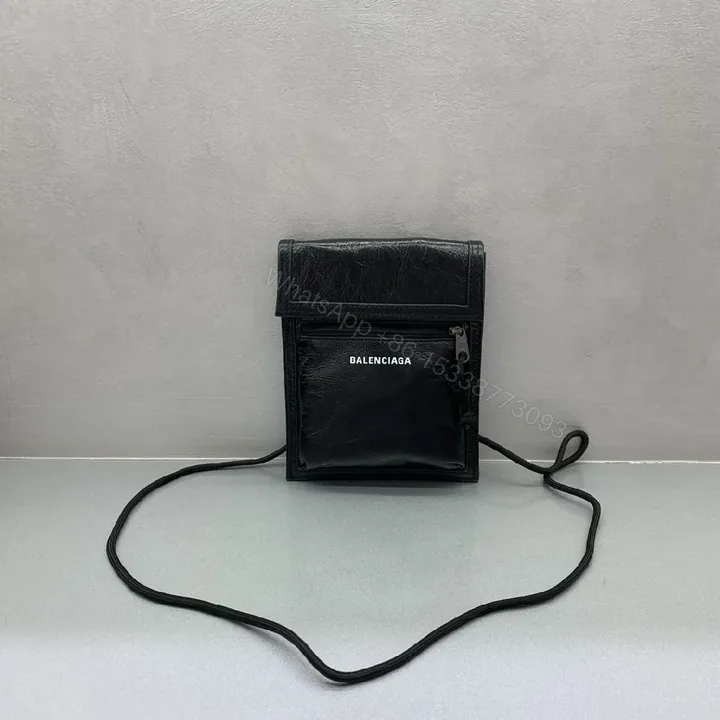 View 1 of Compact Black Leather Crossbody: Modern Texture, Ultra-Functional
