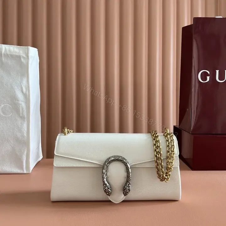 View 1 of Off-White Cream Pebbled Leather Structured Flap Bag with Gold Horseshoe Clasp