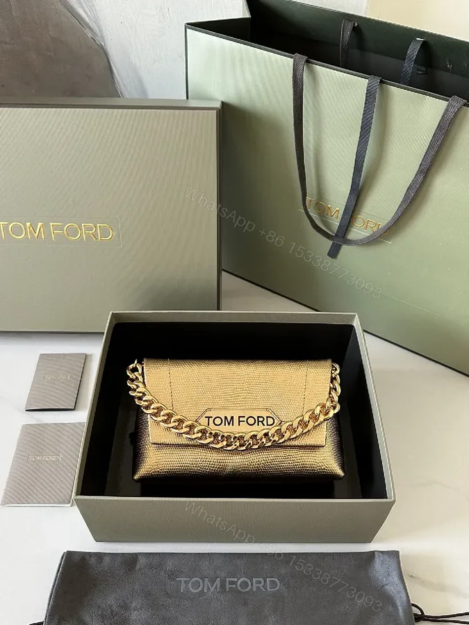 View 1 of Textured Leather Mini Bag with Bold Gold Chain Accent