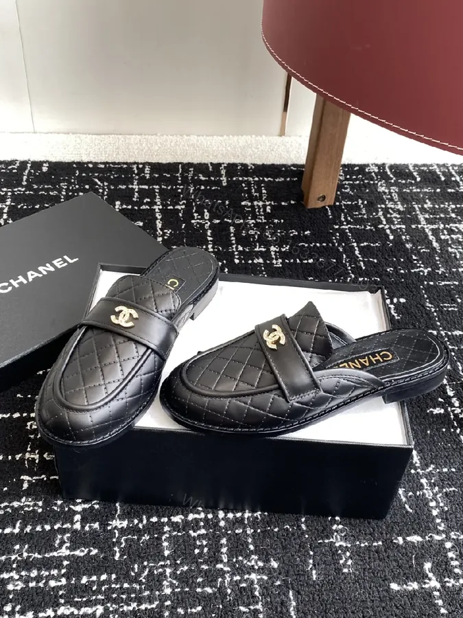 View 1 of Quilted Leather Mules with Gold Logo — Black, Premium Style