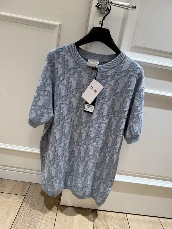 View 1 of Blue Denim Knit Pullover Dior Style Key Feature: Embroidered Pattern Sweater Dress