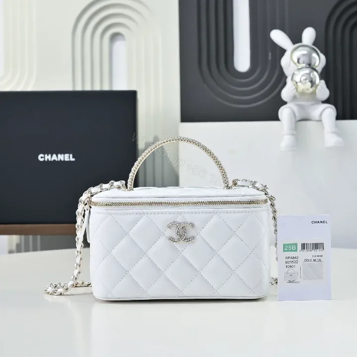 View 1 of Compact White Quilted Crossbody with Silver Chain Emblem