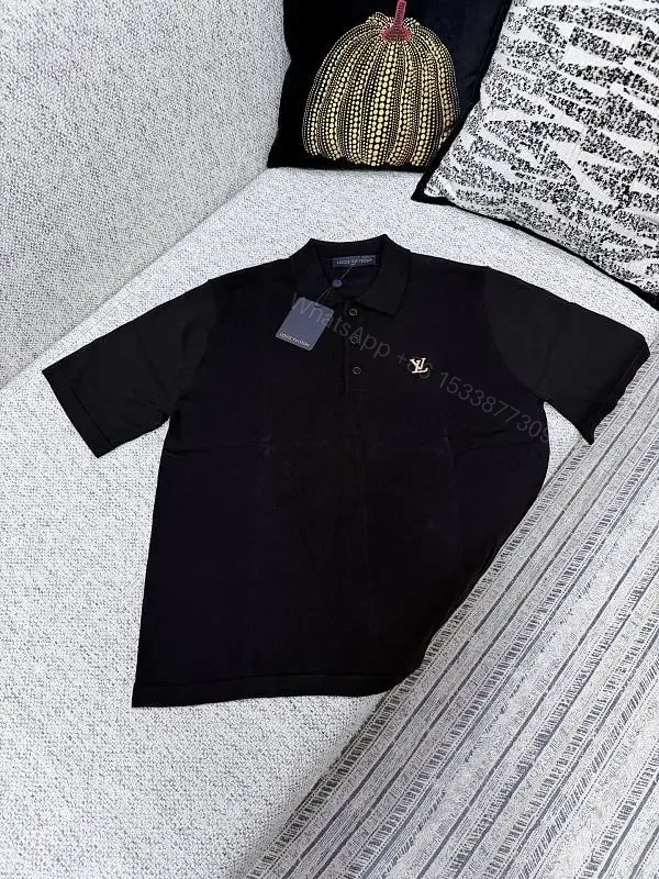 View 1 of Black Polo with Subtle Gold Logo - Refined Everyday Versatility