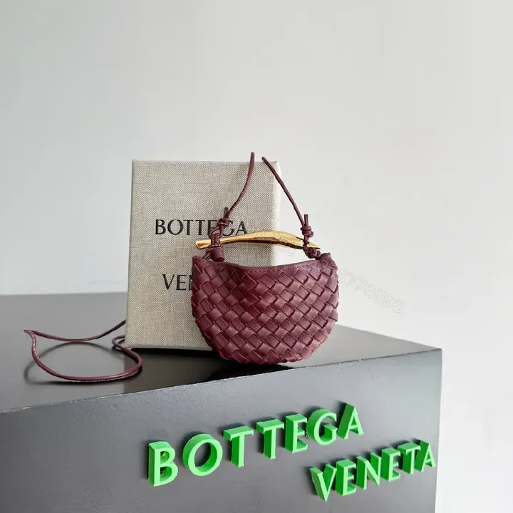 View 1 of Textured Plum Mini Bag: Handwoven Leather, Luxe Compact