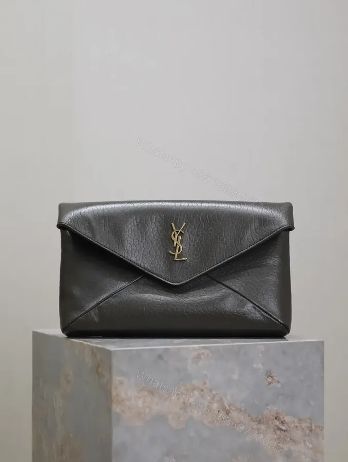 View 1 of Textured Black Leather Envelope Clutch with Gold Logo Signature