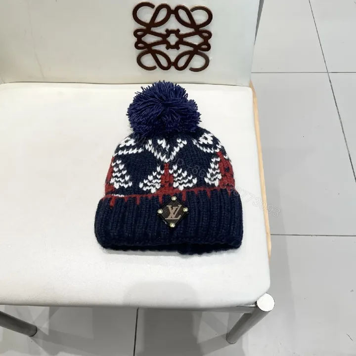 View 1 of Navy Knit Beanie with Pom – Luxe Designer-Inspired Warmth