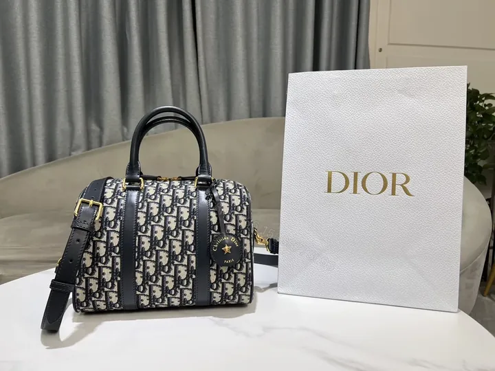 View 1 of Compact Luxury Satchel: Monogram Pattern, Gold Hardware, Crossbody/Top-Handle