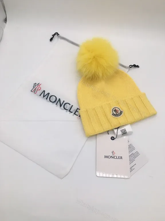 View 1 of Sunny Yellow Moncler Pom Beanie â€“ Luxurious Warmth, Bold Color Pop