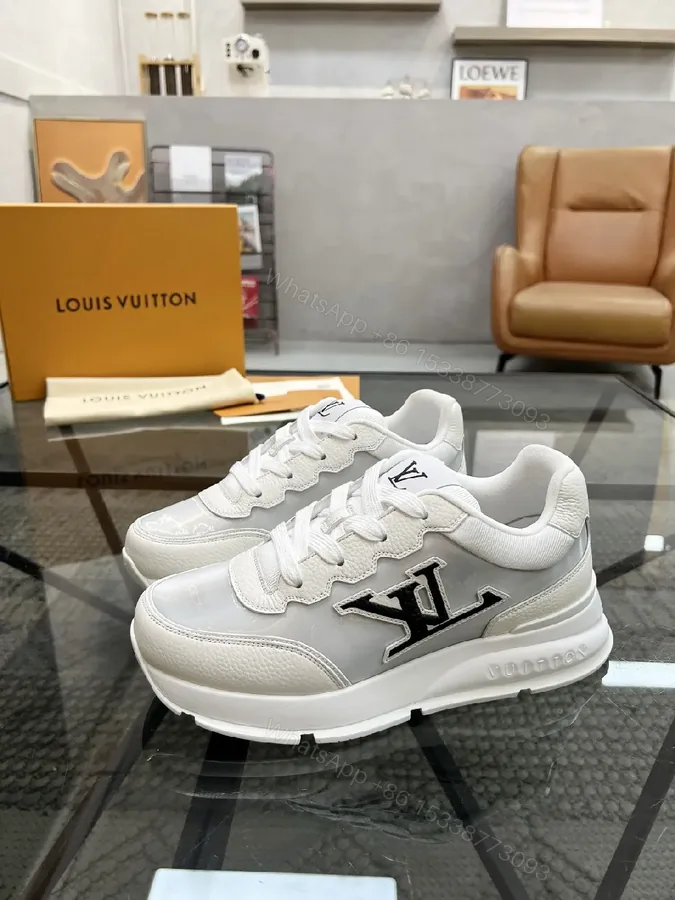 View 1 of White Leather Minimalist Luxe Sneakers with LV Detail